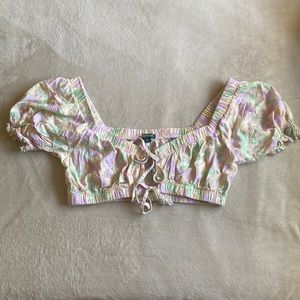 Cropped front tie tank top with puffy sleeves.